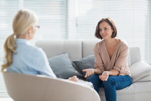 a person talks to a therapist about medication-assisted treatment